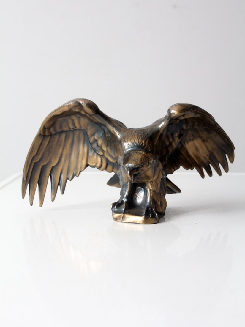 Vintage Brass Eagle Sculpture 8.25 Inch American Bald Eagle: Vintage Brass Eagle Sculpture 8.25 Inch American Bald Eagle This exquisite vintage brass eagle statue beautifully captures the majestic form of an American bald eagle perched atop a rock. Crafted from