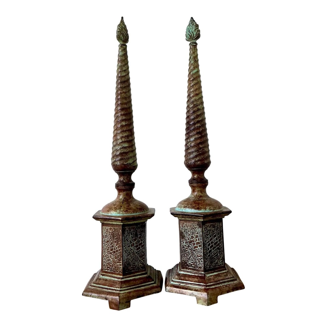 Pair of Cast Metal Obelisks with Verdigris Patina and Fox and Grapes Relief: Pair of Cast Metal Obelisks with Verdigris Patina and Fox and Grapes Relief This pair of vintage cast metal obelisks features a striking spiral 'barley twist' shaft topped with a flame finial, reminis