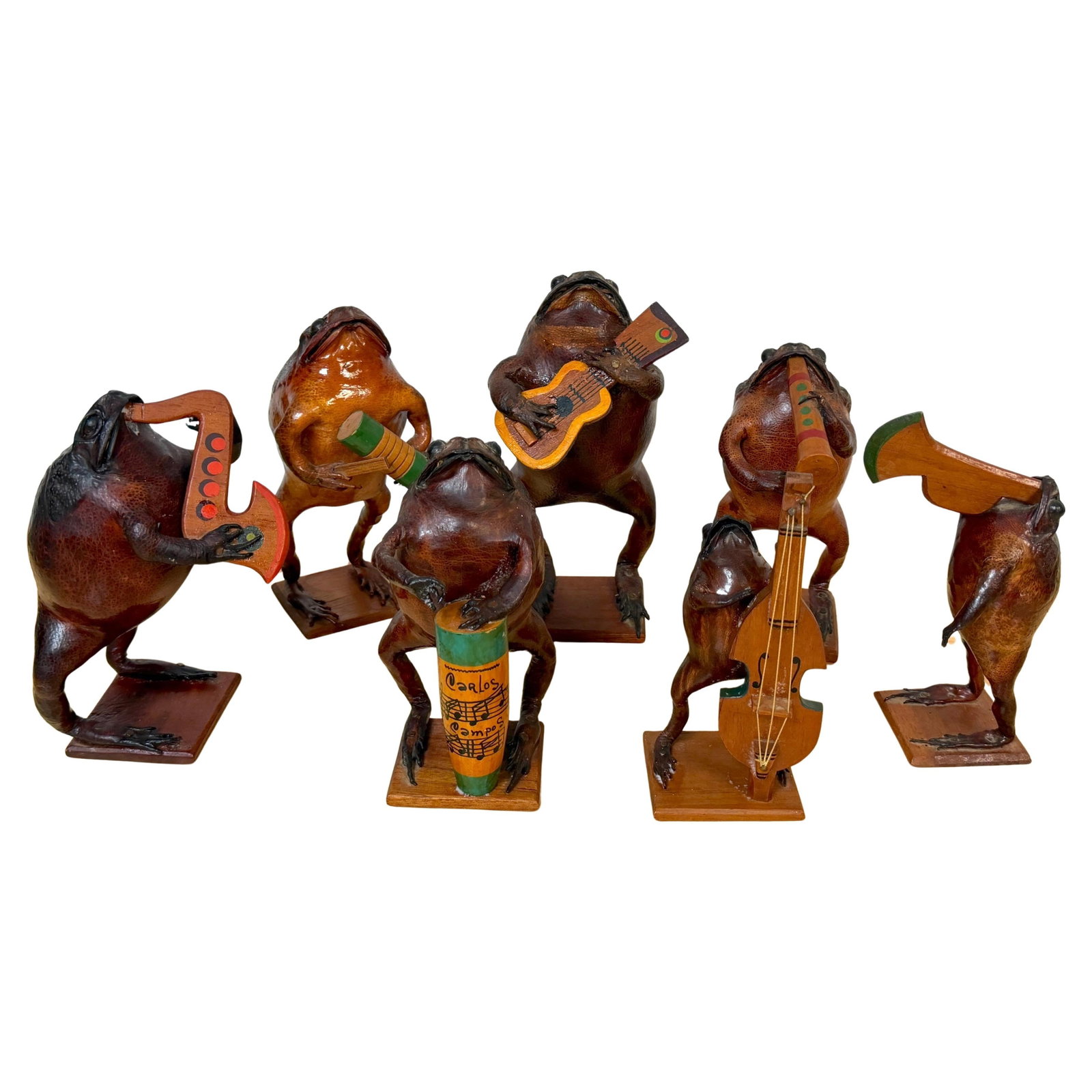 Set of 7 Mexican Folk Art Hand-Carved Wooden Frog Musicians Orchestra: Set of 7 Mexican Folk Art Hand-Carved Wooden Frog Musicians Orchestra This mid-20th century Mexican folk art set features seven hand-carved and painted wooden frog musicians, each representing a diffe