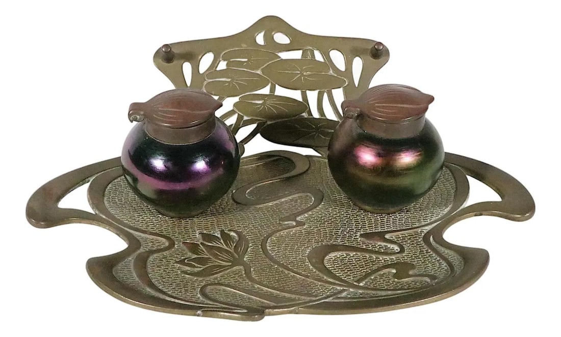 Brass and Art Glass Water Lily Inkwell Art Nouveau Circa 1900: Brass and Art Glass Water Lily Inkwell Art Nouveau Circa 1900 This extraordinary Art Nouveau inkwell features an organic brass base adorned with water lily and lily pad motifs, complemented by two lid