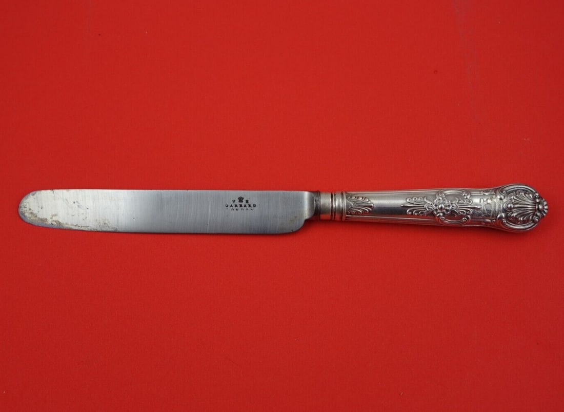 Garrard & Co Queens Sterling Silver Banquet Knife 10 3/4": Garrard & Co Queens Sterling Silver Banquet Knife 10 3/4" This elegant banquet knife from the Queens pattern by Garrard & Co. features a beautiful sterling silver hollow handle complemented by a durab
