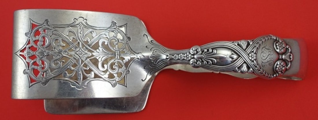 Tiffany & Co Saint James Sterling Silver Asparagus Serving Tong 7.5": Tiffany & Co Saint James Sterling Silver Asparagus Serving Tong 7.5" Elevate your dining experience with this exquisite asparagus serving tong from Tiffany & Co.'s Saint James pattern. Crafted from hi