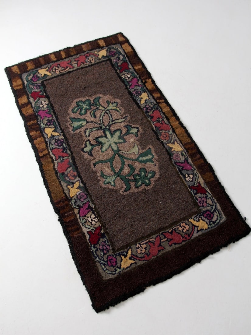 19th Century Floral Antique Hooked Rug 65.5x35 Inch: 19th Century Floral Antique Hooked Rug 65.5x35 Inch Discover this exquisite 19th century antique hooked rug, showcasing a stunning floral design in rich hues of burgundy, magenta, gold, brick red, and
