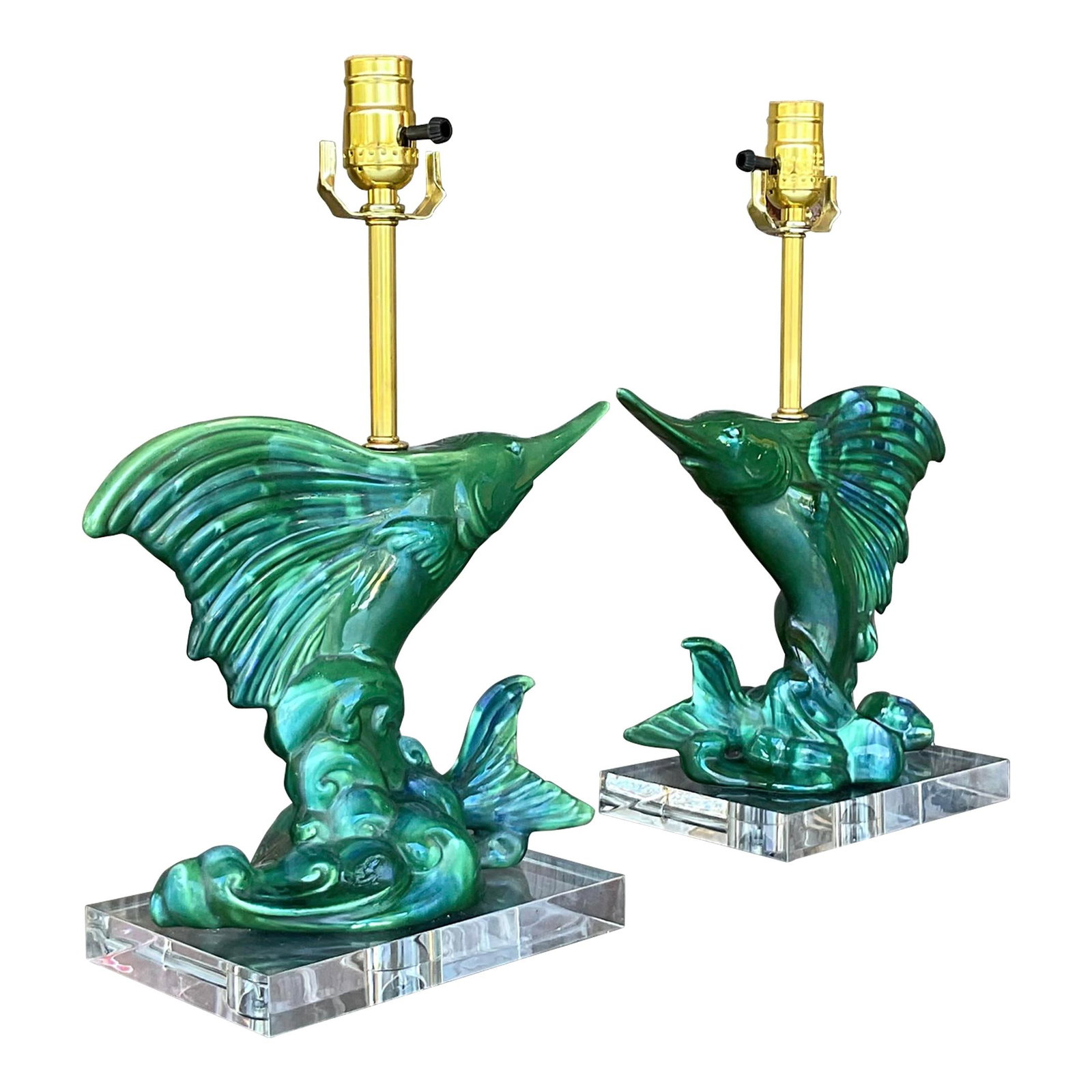 Pair of Vintage Royal Haeger Sailfish Lamps in Bottle Green: Pair of Vintage Royal Haeger Sailfish Lamps in Bottle Green Enhance your home with this exquisite pair of vintage coastal Royal Haeger sailfish lamps. These stunning ceramic lamps showcase elegantly s