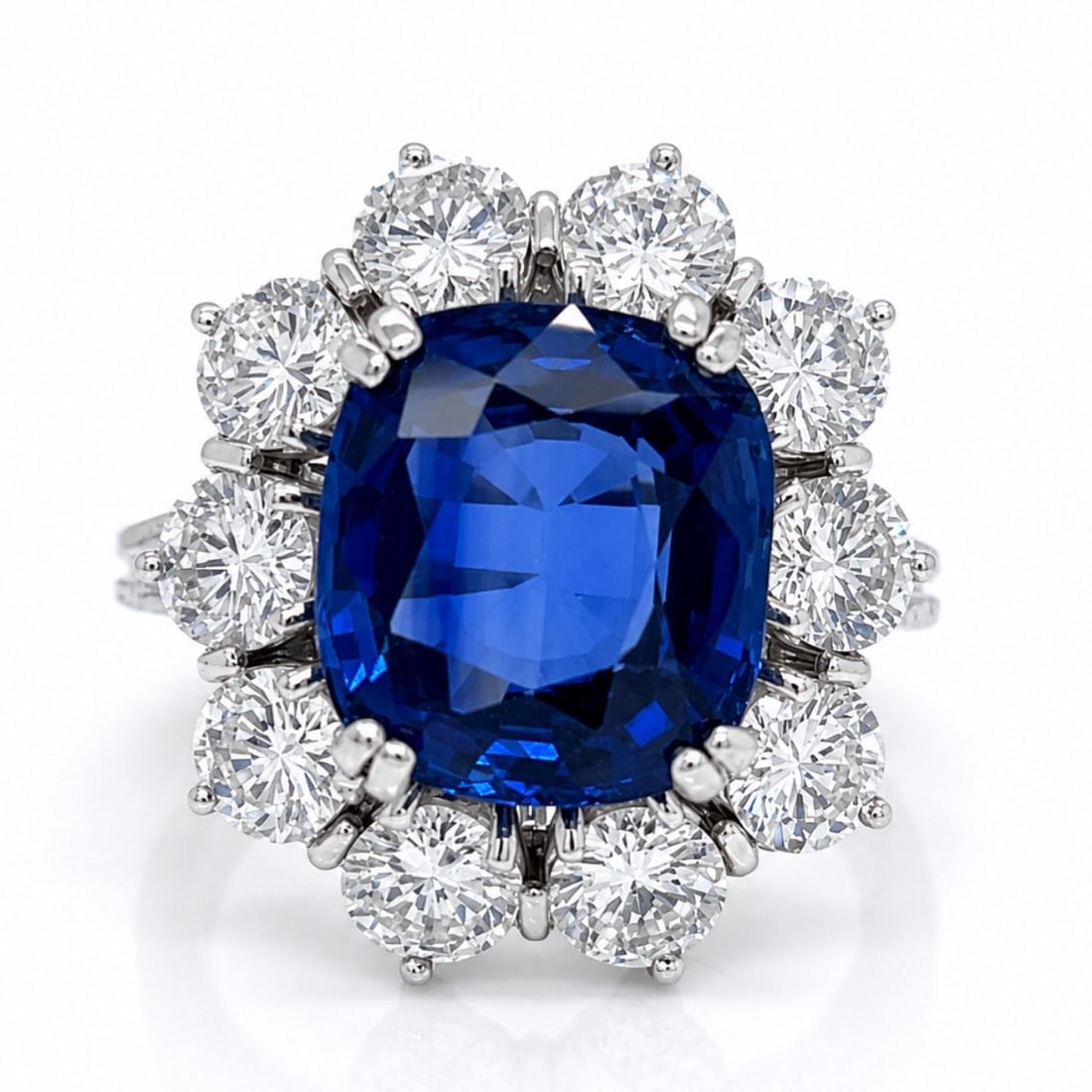 Platinum GIA Heated Madagascar Sapphire Ring with 10 Diamonds: Platinum GIA Heated Madagascar Sapphire Ring with 10 Diamonds This platinum ring features a GIA certified heated Madagascar sapphire weighing approximately 7.00 carats, measuring 11.28 x 10.30 x 5.58 