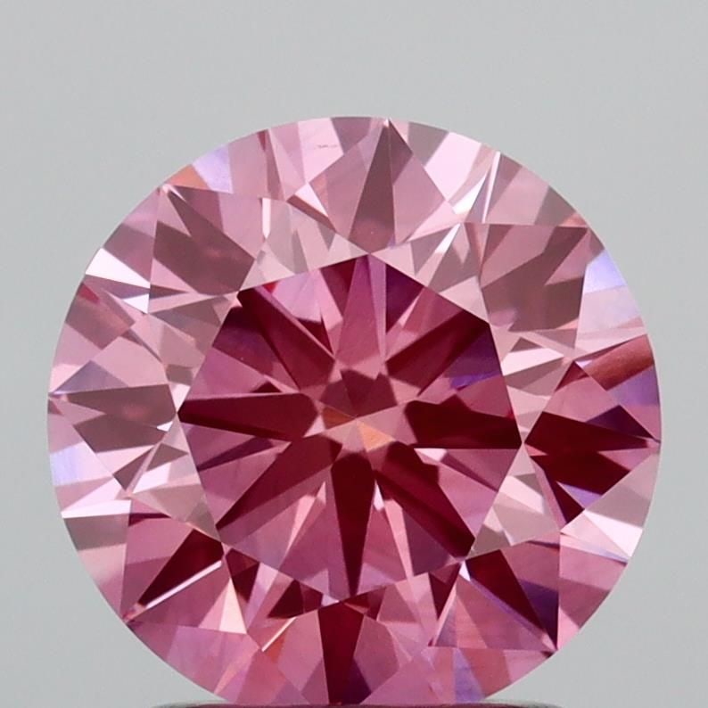 Ideal Loose Diamond - ROUND 1.71ct Fancy Vivid Pink VS1: Ideal Loose Diamond - ROUND 1.71ct Fancy Vivid Pink VS1 Source: This is a real non-mined Diamond that has been grown in a lab Shape: ROUND Carats: 1.71 Color: Fancy Vivid Pink Certification: IGI Video