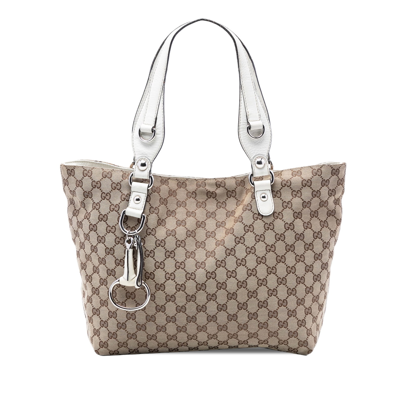 Gucci beige canvas tote with leather trim and bit detail: Gucci beige canvas tote with leather trim and bit detail This Gucci Medium GG Canvas Icon Bit Tote is crafted in Italy and features a beige canvas body with leather trim. The bag is designed with flat
