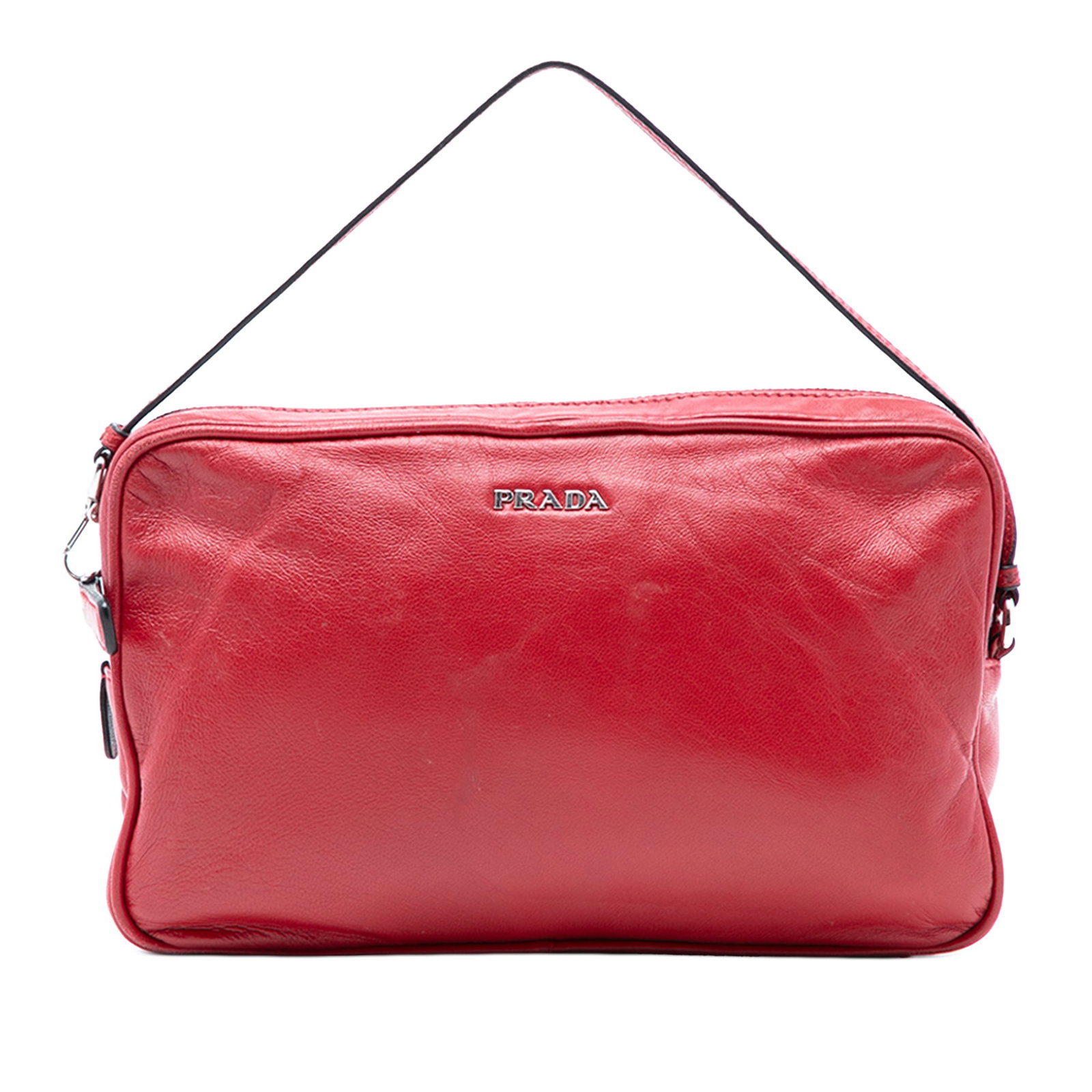 Red Prada Italian Leather Tote with Top Zip Closure: Red Prada Italian Leather Tote with Top Zip Closure This Prada handbag showcases a red leather body with a flat leather handle and a top zip closure. The item has signs of wear on the exterior back, b
