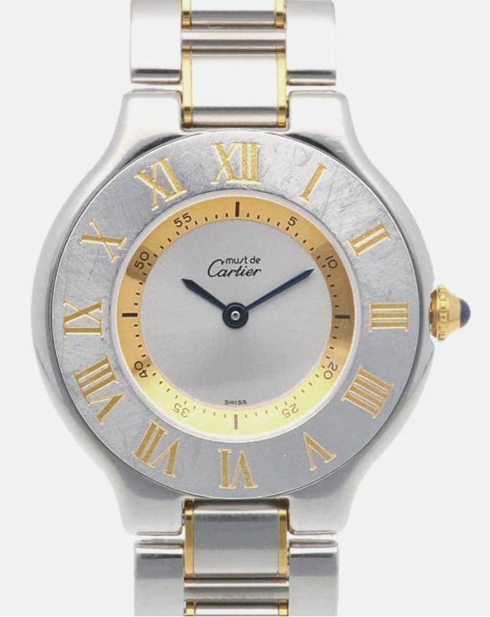 Ladies Cartier Must de Cartier 21 2-Tone Silver Dial Ref 1340: Ladies Cartier Must de Cartier 21 2-Tone Silver Dial Ref 1340 This ladies' Cartier 21 Must de Cartier watch features a silver dial with Roman numeral bezel and a two-tone bracelet. The timepiece is pa