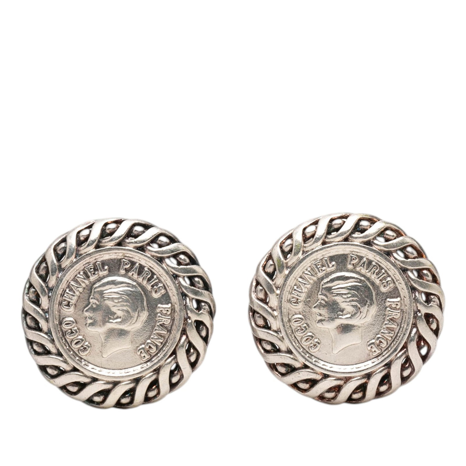Chanel medallion clip on earrings silver plated metal: Chanel medallion clip on earrings silver plated metal These Chanel clip-on earrings feature silver plated metal with a medallion design. Made in France, they are categorized as costume jewelry and hav