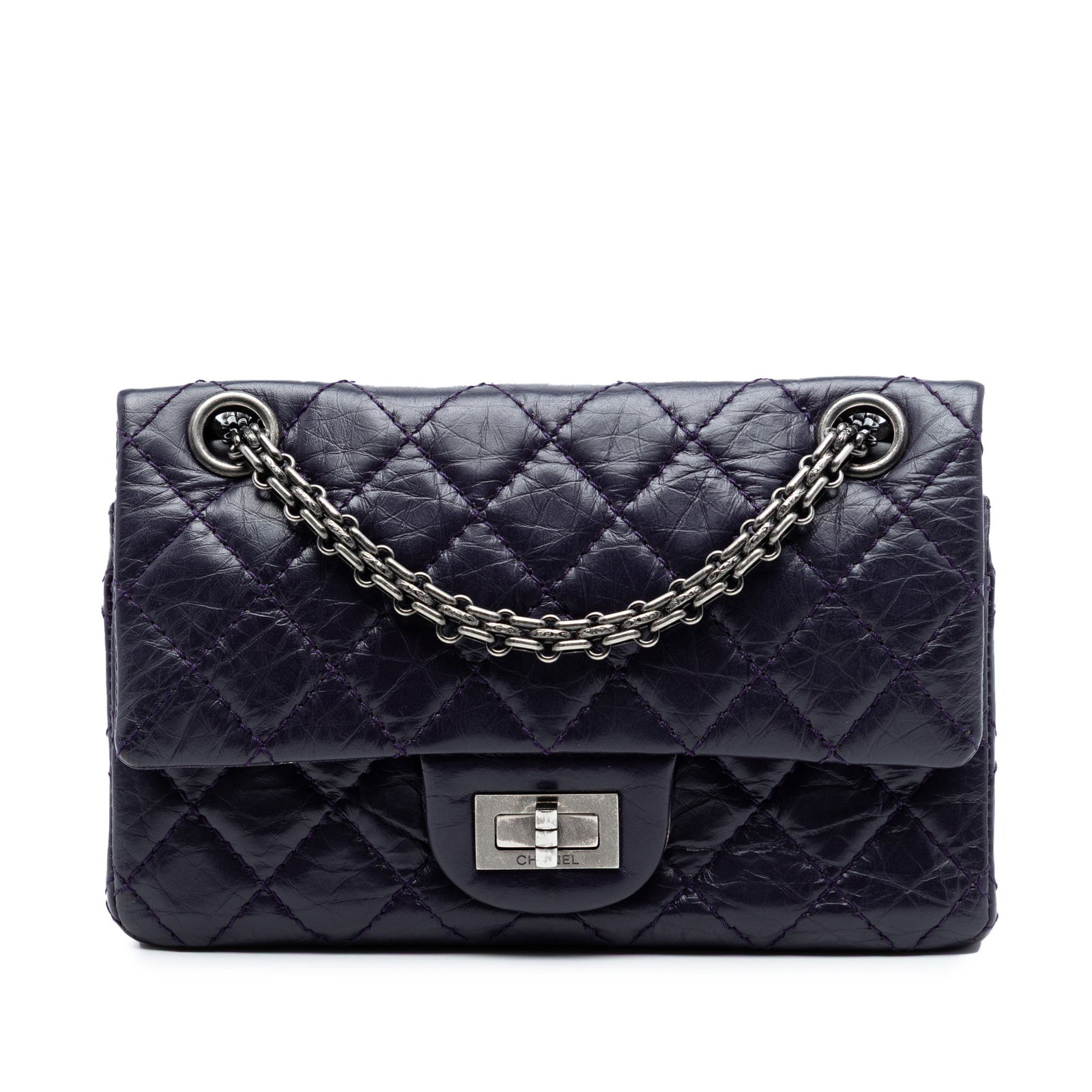Chanel Reissue 2.55 Purple Quilted Calfskin Double Flap Bag: Chanel Reissue 2.55 Purple Quilted Calfskin Double Flap Bag This Chanel Quilted Aged Calfskin Reissue 2.55 Double Flap 224 shoulder bag is crafted from aged calfskin leather in a purple hue. It featur