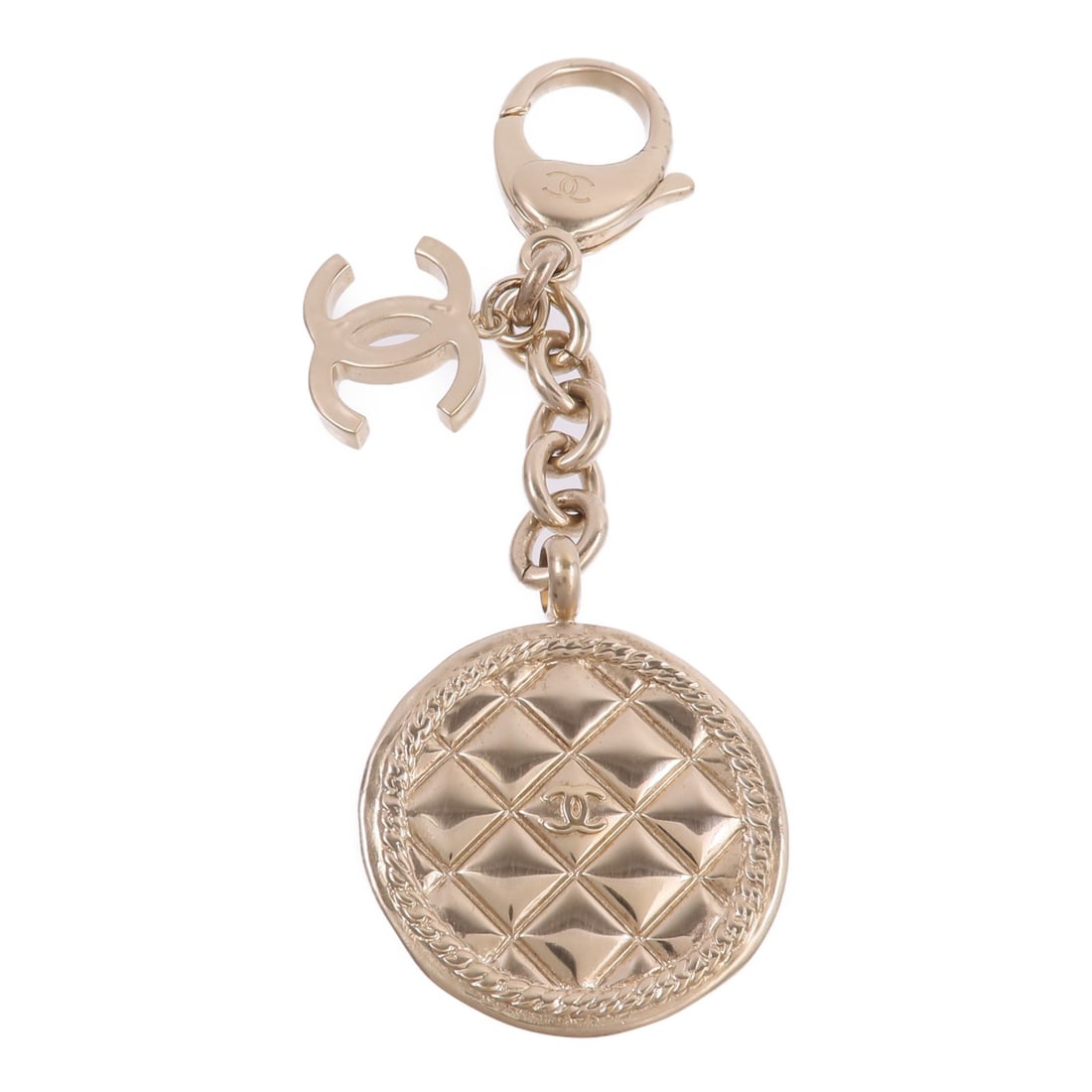 CHANEL CC Gold Tone Metal Keychain Charm: CHANEL CC Gold Tone Metal Keychain Charm This CHANEL key chain charm features the iconic CC logo in a gold-tone metal finish. Designed for women, it adds a touch of elegance to bags, keys, or accessor
