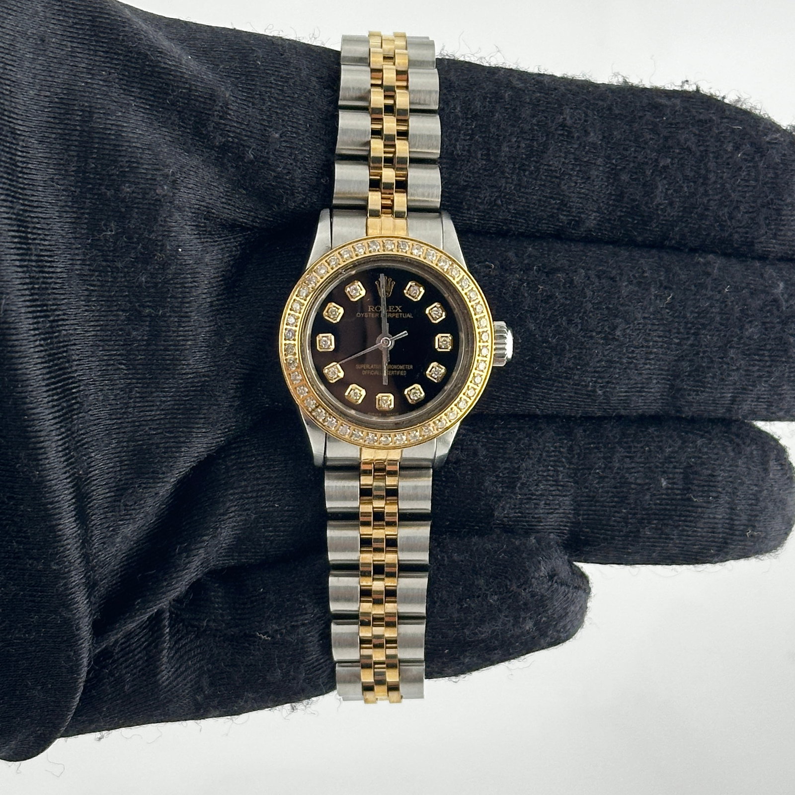 Ladies Aftermarket Jubilee Bracelet Rolex 6623 with Black Diamond Dial: Ladies Aftermarket Jubilee Bracelet Rolex 6623 with Black Diamond Dial This ladies Rolex Oyster Perpetual features an aftermarket black dial set with diamonds and an aftermarket Jubilee bracelet. The 
