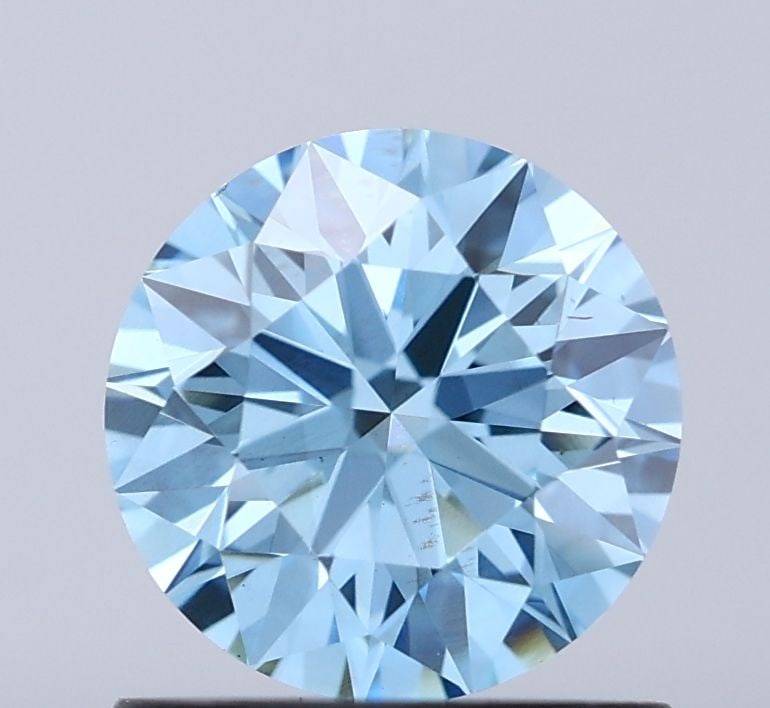 Loose Diamond - ROUND 0.9ct Fancy Vivid Blue VS1: Loose Diamond - ROUND 0.9ct Fancy Vivid Blue VS1 Source: This is a real non-mined Diamond that has been grown in a lab Shape: ROUND Carats: 0.9 Color: Fancy Vivid Blue Certification: IGI Video:
