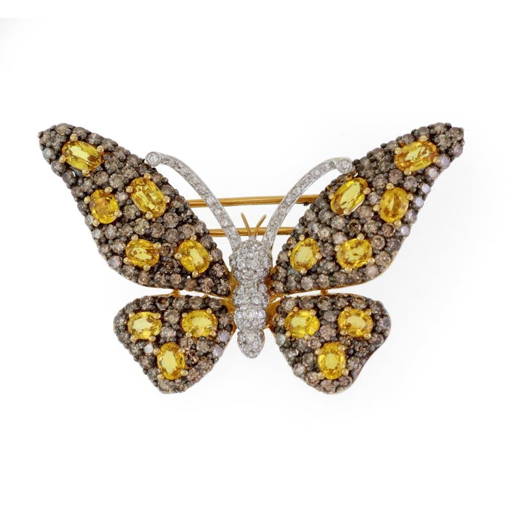 18k Gold Butterfly Pendant with Diamond and Yellow Sapphire Accents: 18k Gold Butterfly Pendant with Diamond and Yellow Sapphire Accents This exquisite butterfly pendant and brooch is an elegant piece of jewelry, skillfully crafted from 18k yellow and white gold. The