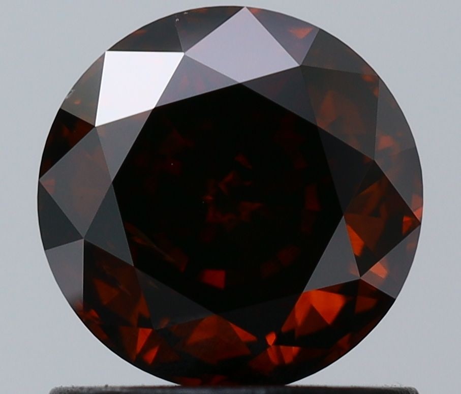 Loose Diamond - ROUND 1.03ct Fancy Dark Orangey Brown I1: Loose Diamond - ROUND 1.03ct Fancy Dark Orangey Brown I1 Source: Natural Shape: ROUND Carats: 1.03 Color: Fancy Dark Orangey Brown Certification: GIA Video: