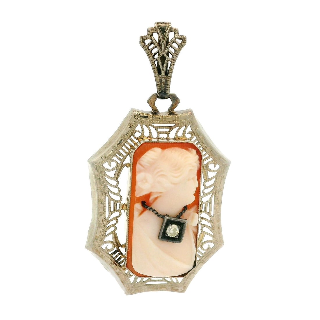 Antique Art Deco 14k White Gold Diamond Cameo Pendant: Antique Art Deco 14k White Gold Diamond Cameo Pendant This exquisite Antique Art Deco pendant features a delicate filigree frame crafted from solid 14k white gold. At its center lies a beautifully