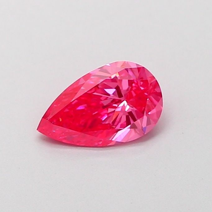 Loose Diamond - PEAR 0.68ct Fancy Vivid Pink VVS2: Loose Diamond - PEAR 0.68ct Fancy Vivid Pink VVS2 Source: This is a real non-mined Diamond that has been grown in a lab Shape: PEAR Carats: 0.68 Color: Fancy Vivid Pink Certification: IGI Video:
