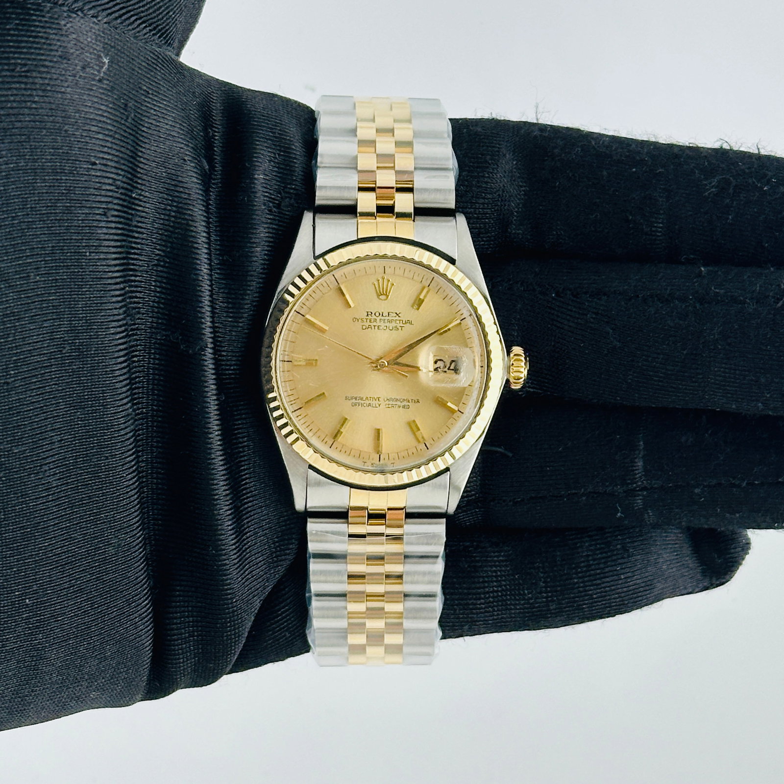 Datejust 1601 Champagne Stick Dial Mens Watch with Aftermarket Jubilee Bracelet: Datejust 1601 Champagne Stick Dial Mens Watch with Aftermarket Jubilee Bracelet This Rolex Datejust features a champagne stick dial and a fluted bezel, paired with an aftermarket Jubilee bracelet.