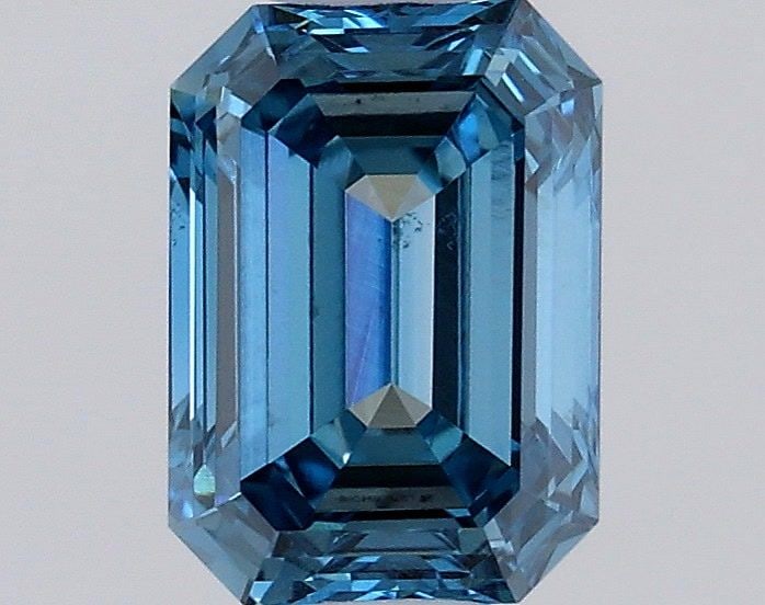 Loose Diamond - EMERALD 0.57ct Fancy Vivid Blue VS2: Loose Diamond - EMERALD 0.57ct Fancy Vivid Blue VS2 Source: This is a real non-mined Diamond that has been grown in a lab Shape: EMERALD Carats: 0.57 Color: Fancy Vivid Blue Certification: IGI Video: