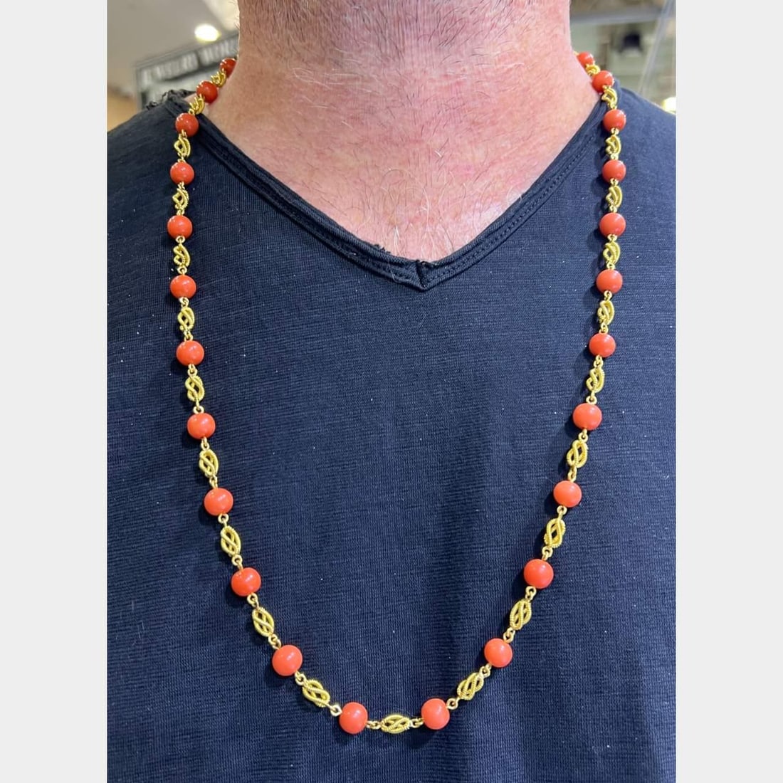 Vintage 1960's 18K Yellow Gold Coral Necklace with Hallmarks: Vintage 1960's 18K Yellow Gold Coral Necklace with Hallmarks This stunning 1960's necklace features exquisite 18K yellow gold adorned with vibrant coral stones. Weighing 50.9 grams and measuring
