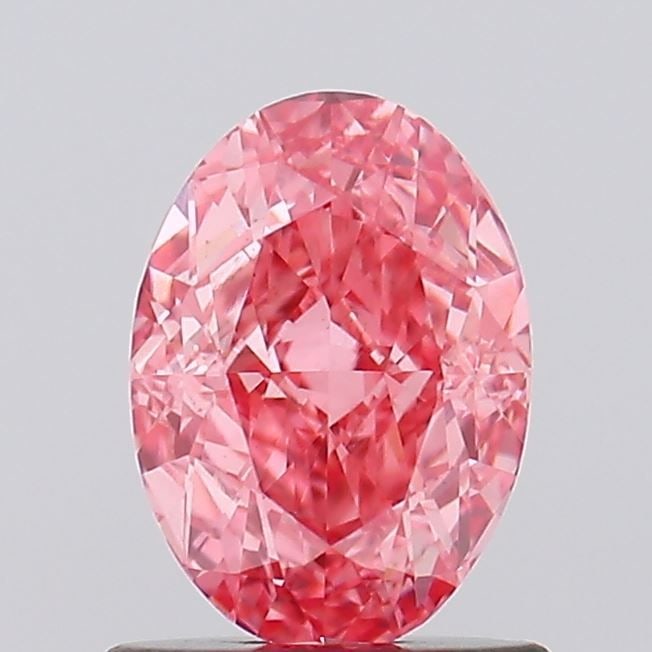 Loose Diamond - OVAL 1.0ct Fancy Vivid Pink VS1: Loose Diamond - OVAL 1.0ct Fancy Vivid Pink VS1 Source: This is a real non-mined Diamond that has been grown in a lab Shape: OVAL Carats: 1.0 Color: Fancy Vivid Pink Certification: IGI Video: