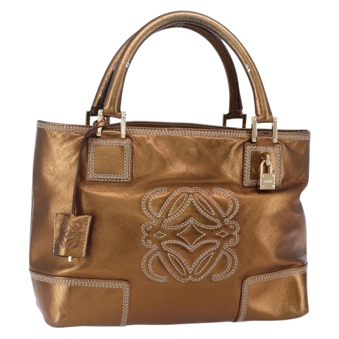 Metallic Leather Vintage Anagram Tote Bag by Loewe: Metallic Leather Vintage Anagram Tote Bag by Loewe This Loewe Vintage Anagram Tote is crafted from metallic leather and designed for women. The bag features the iconic Anagram motif and is made in Spa
