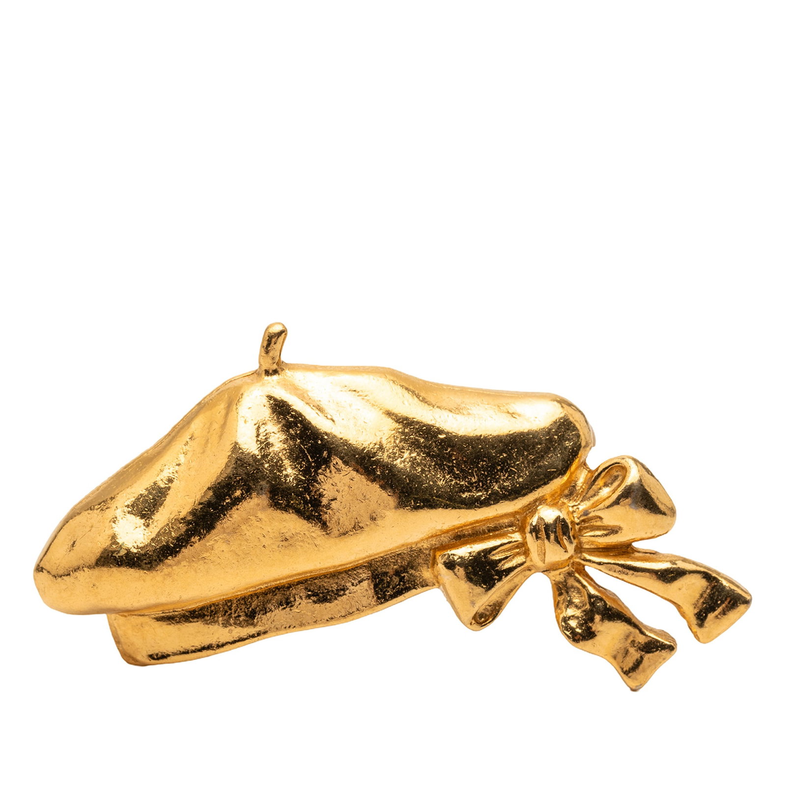 Chanel Metal Brooch in Gold Tone Beret Hat Design: Chanel Metal Brooch in Gold Tone Beret Hat Design This Chanel brooch features a gold-plated metal design in the shape of a beret hat. It is equipped with a back pin closure. The piece shows signs of w