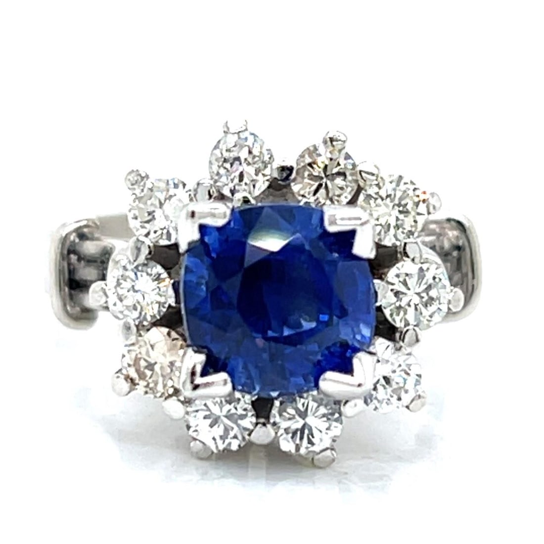 Platinum Ring Featuring 2.87 Carat Sapphire and Diamonds from the 1950s: Platinum Ring Featuring 2.87 Carat Sapphire and Diamonds from the 1950s This pre-owned ring from the 1950s is crafted in platinum and features a 2.87 carat sapphire as its centerpiece. The ring is acc