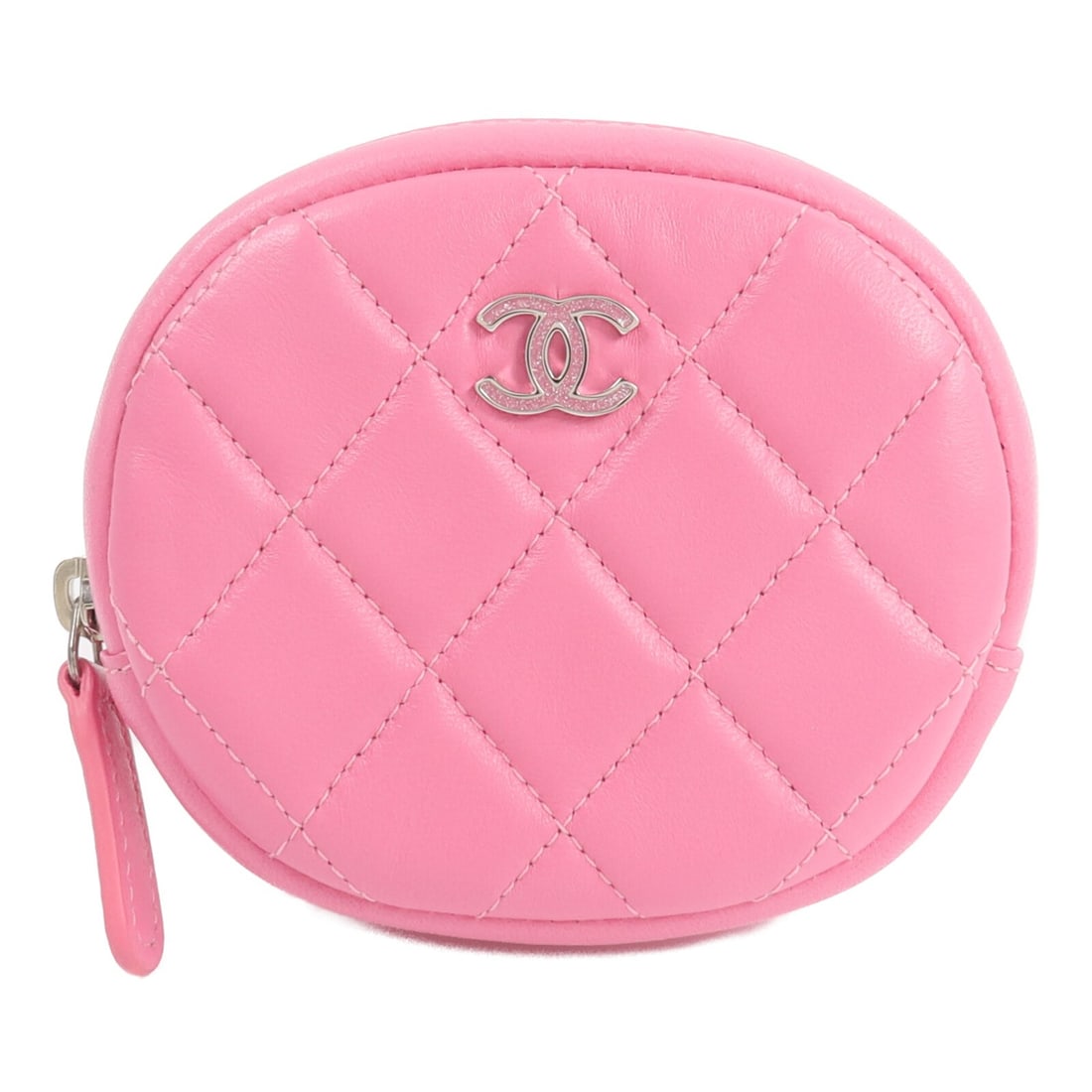 Pink Lambskin CHANEL CC Coin Purse: Pink Lambskin CHANEL CC Coin Purse This CHANEL coin purse is crafted from luxurious pink lambskin leather and features the iconic CC logo with silver hardware. Designed for women, it offers a stylish