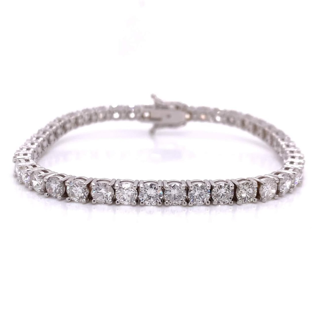 18K White Gold 11.40 Ct Diamond Tennis Bracelet with 42 Diamonds: 18K White Gold 11.40 Ct Diamond Tennis Bracelet with 42 Diamonds This exquisite 18K White Gold Diamond Tennis Bracelet features a stunning arrangement of 42 round diamonds, totaling approximately