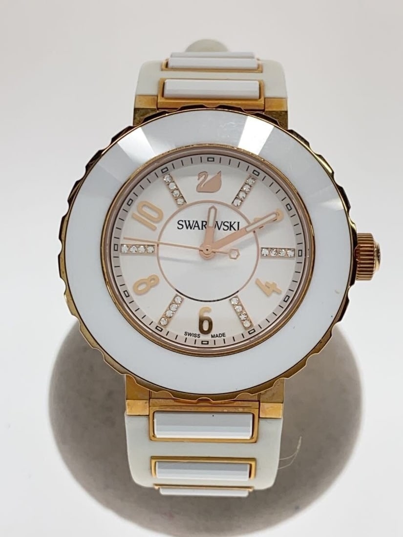 Swarovski White Rubber Women's Quartz Wristwatch: Swarovski White Rubber Women's Quartz Wristwatch This Swarovski quartz women's wristwatch features a white rubber band and a stylish design. Made with materials sourced from Switzerland, this pre-owne
