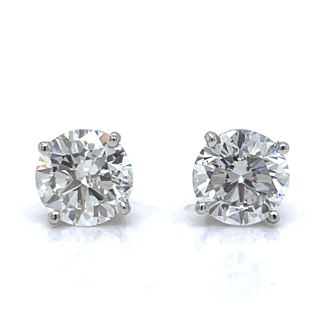 GIA Certified Diamond Stud Earrings in 14K White Gold 3.41 Carats: GIA Certified Diamond Stud Earrings in 14K White Gold 3.41 Carats These pre-owned stud earrings are crafted in 14K white gold and set with two GIA certified diamonds. One earring features a 1.70 carat