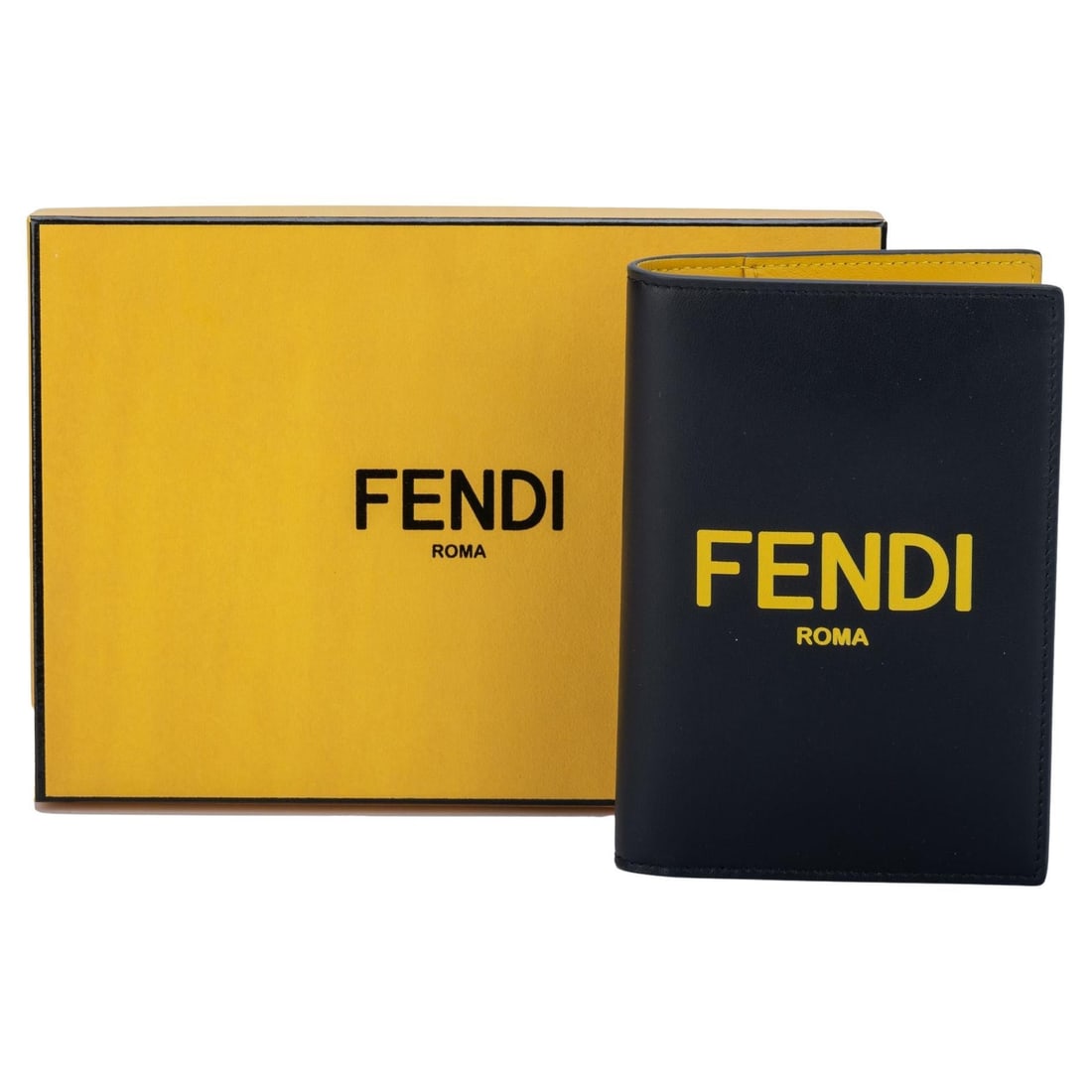 Fendi Black Yellow Lambskin Passport Cover with Box Italy: Fendi Black Yellow Lambskin Passport Cover with Box Italy Introducing a striking passport cover by Fendi, crafted from luxurious black and yellow lambskin. This stylish accessory is perfect for the mo