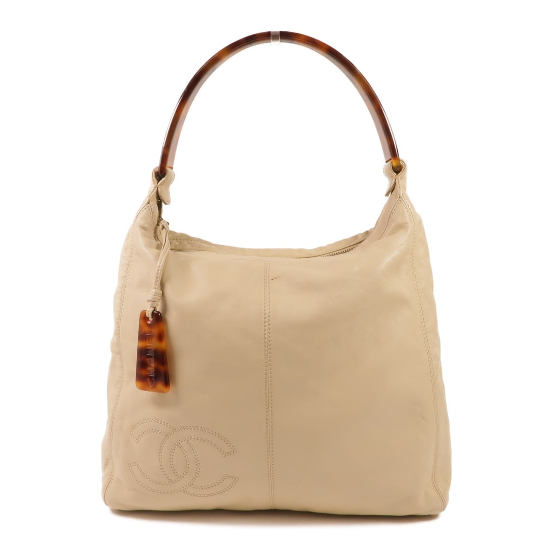 CHANEL Beige Leather CC Shoulder Bag GHW: CHANEL Beige Leather CC Shoulder Bag GHW This CHANEL handbag features a classic beige leather exterior and is designed for versatile use as both a shoulder bag and a handbag. Crafted for women, it off