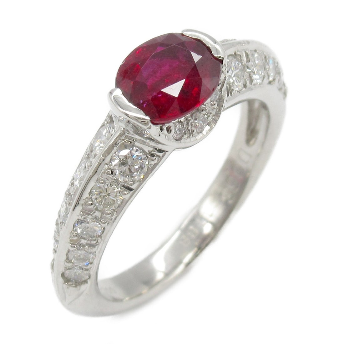 JEWELRY Ruby Ring in PT900 Platinum Size 5.75: JEWELRY Ruby Ring in PT900 Platinum Size 5.75 This exquisite ring features a stunning red ruby set in luxurious PT900 platinum. The ring is designed in a classic style, making it a perfect accessory f