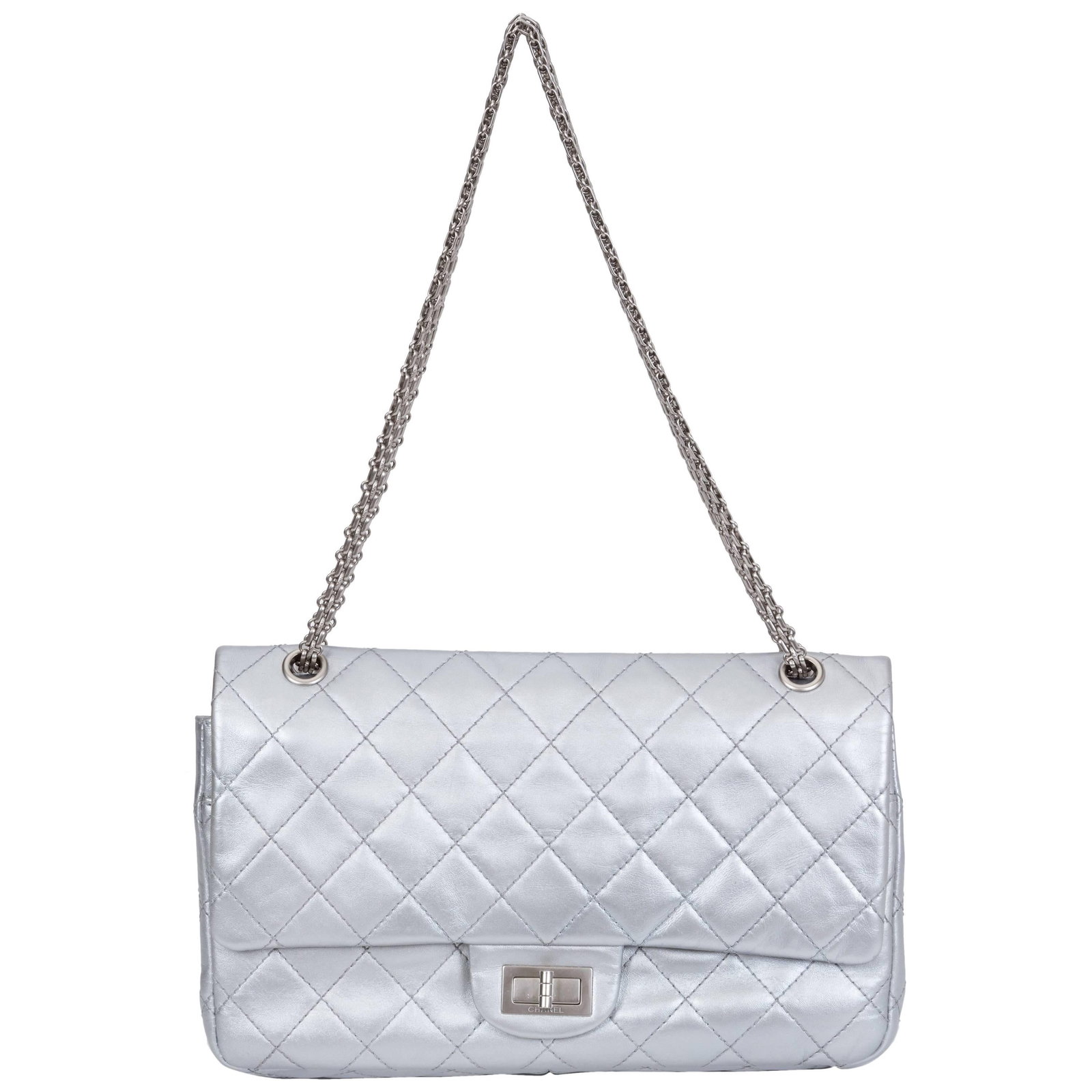 Chanel Silver Jumbo Reissue Double Flap Bag with Hologram: Chanel Silver Jumbo Reissue Double Flap Bag with Hologram This Chanel Silver Jumbo Reissue Double Flap is a stunning piece that combines luxury and functionality. Crafted from metallic silver
