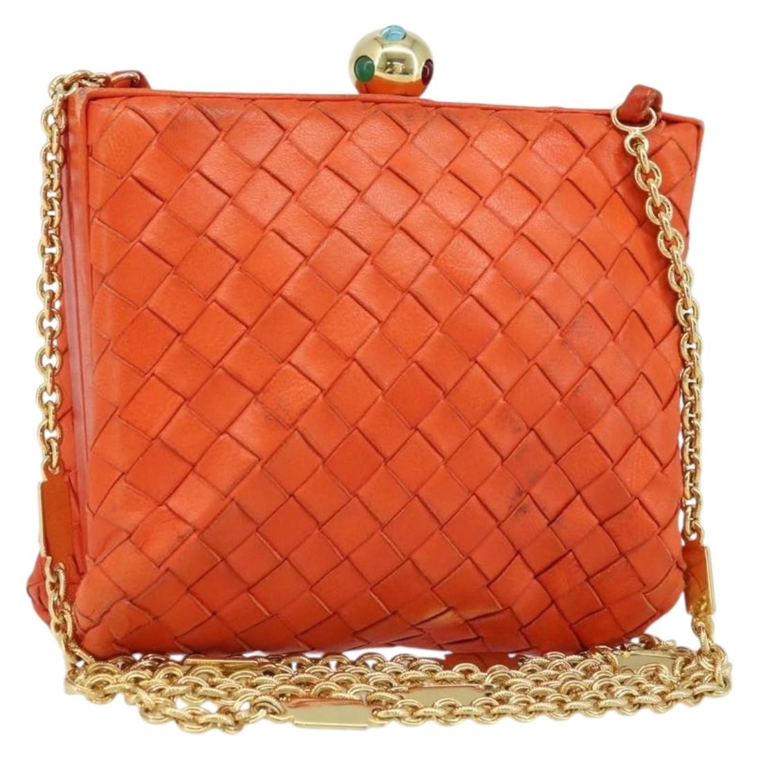Bottega Veneta Orange Leather Intrecciato Clutch: Bottega Veneta Orange Leather Intrecciato Clutch This Bottega Veneta Intrecciato clutch bag is crafted from orange leather and features the brand's signature woven design. Made in Italy, the bag is de