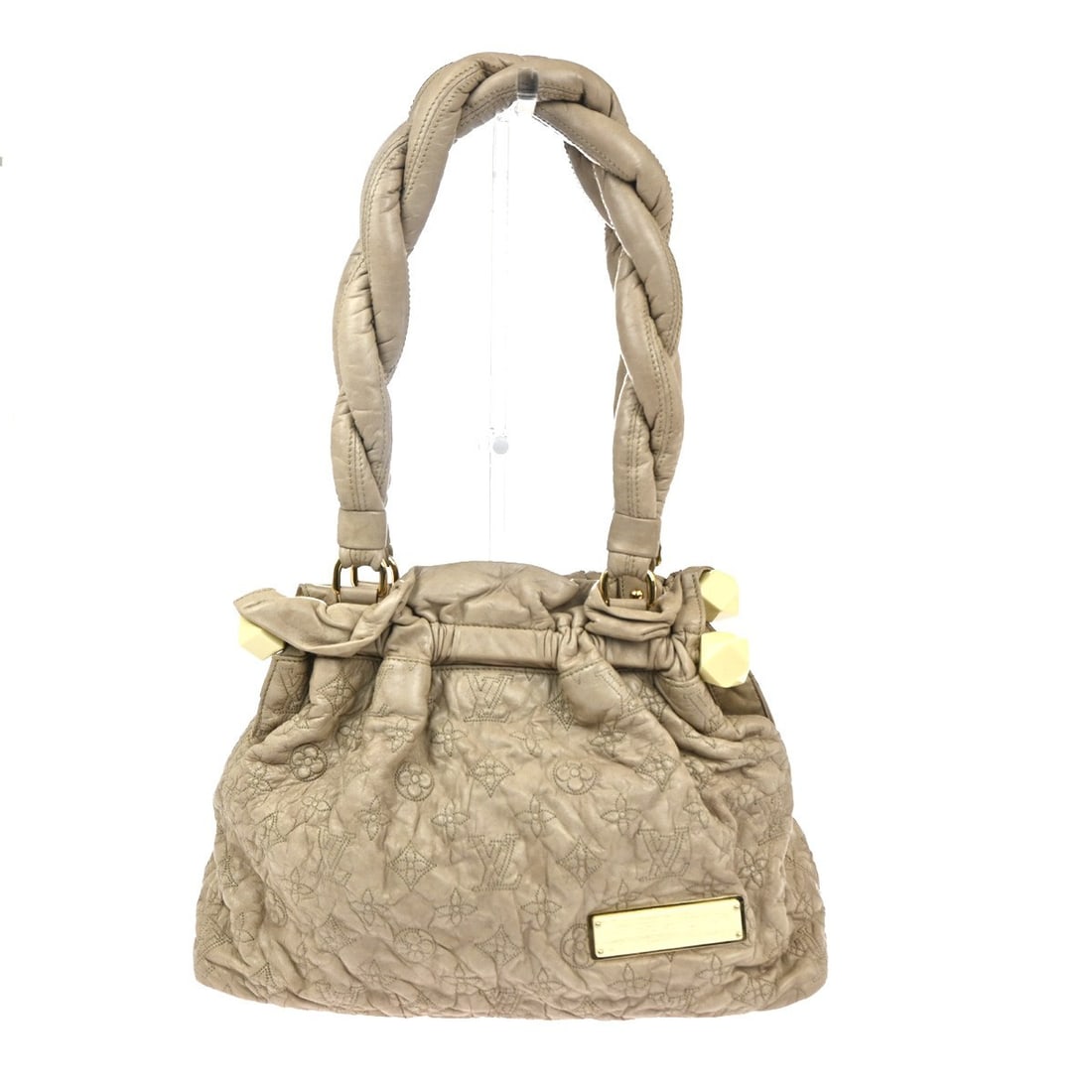 Olympe Stratus Monogram Lambskin Beige Handbag Limited Edition by Louis Vuitton: Olympe Stratus Monogram Lambskin Beige Handbag Limited Edition by Louis Vuitton The Louis Vuitton Olympe Stratus Handbag is a limited edition piece crafted from monogram lambskin leather in beige. Des