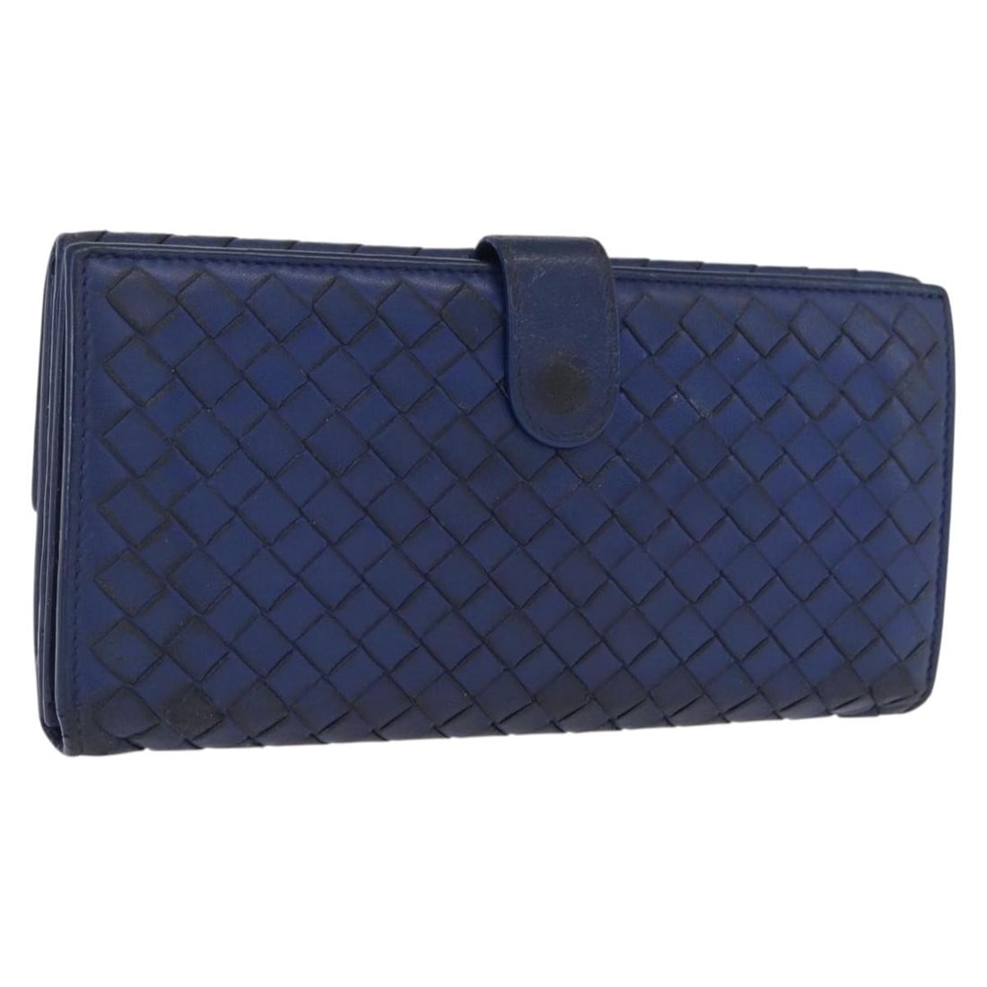 Blue Leather Intrecciato Long Wallet by Bottega Veneta Italy: Blue Leather Intrecciato Long Wallet by Bottega Veneta Italy This Bottega Veneta Intrecciato long wallet for women is crafted from blue leather and made in Italy. The wallet features a button clasp cl