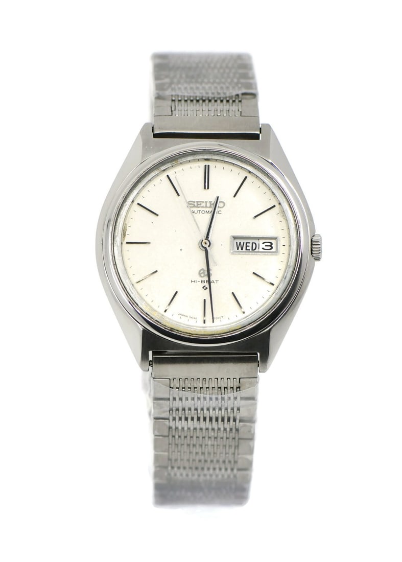 Grand Seiko Hi-Beat Day Date Stainless Steel Watch with Aftermarket Bracelet: Grand Seiko Hi-Beat Day Date Stainless Steel Watch with Aftermarket Bracelet Experience the elegance of the Grand Seiko Hi-Beat Day Date Stainless Steel Watch, featuring a sophisticated silver dial an