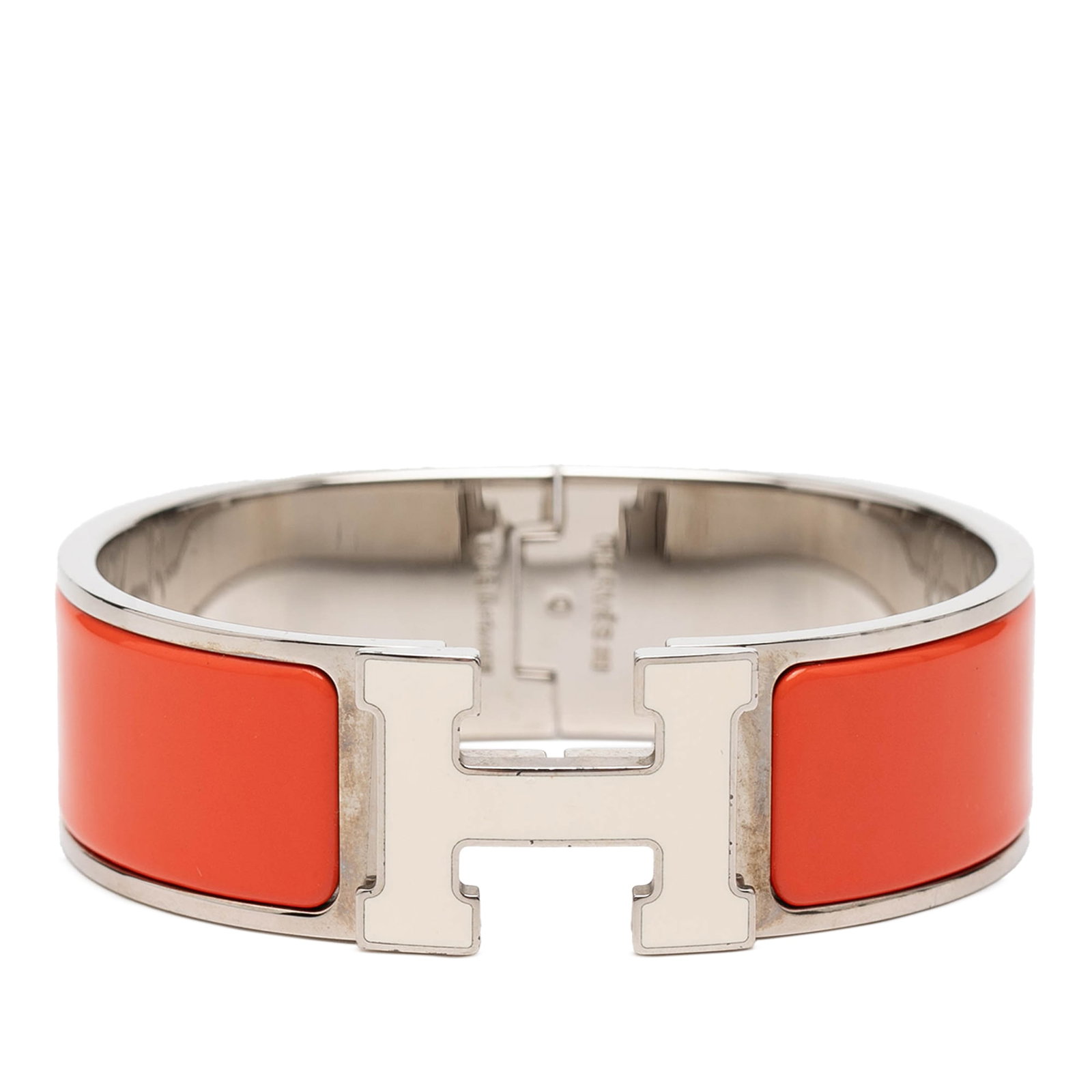 Hermes Wide Enamel Clic H PM Orange Palladium Bracelet: Hermes Wide Enamel Clic H PM Orange Palladium Bracelet This Hermes Wide Enamel Clic H Bracelet PM features a vibrant orange enamel set in a palladium-plated metal body, complemented by a metal clasp c