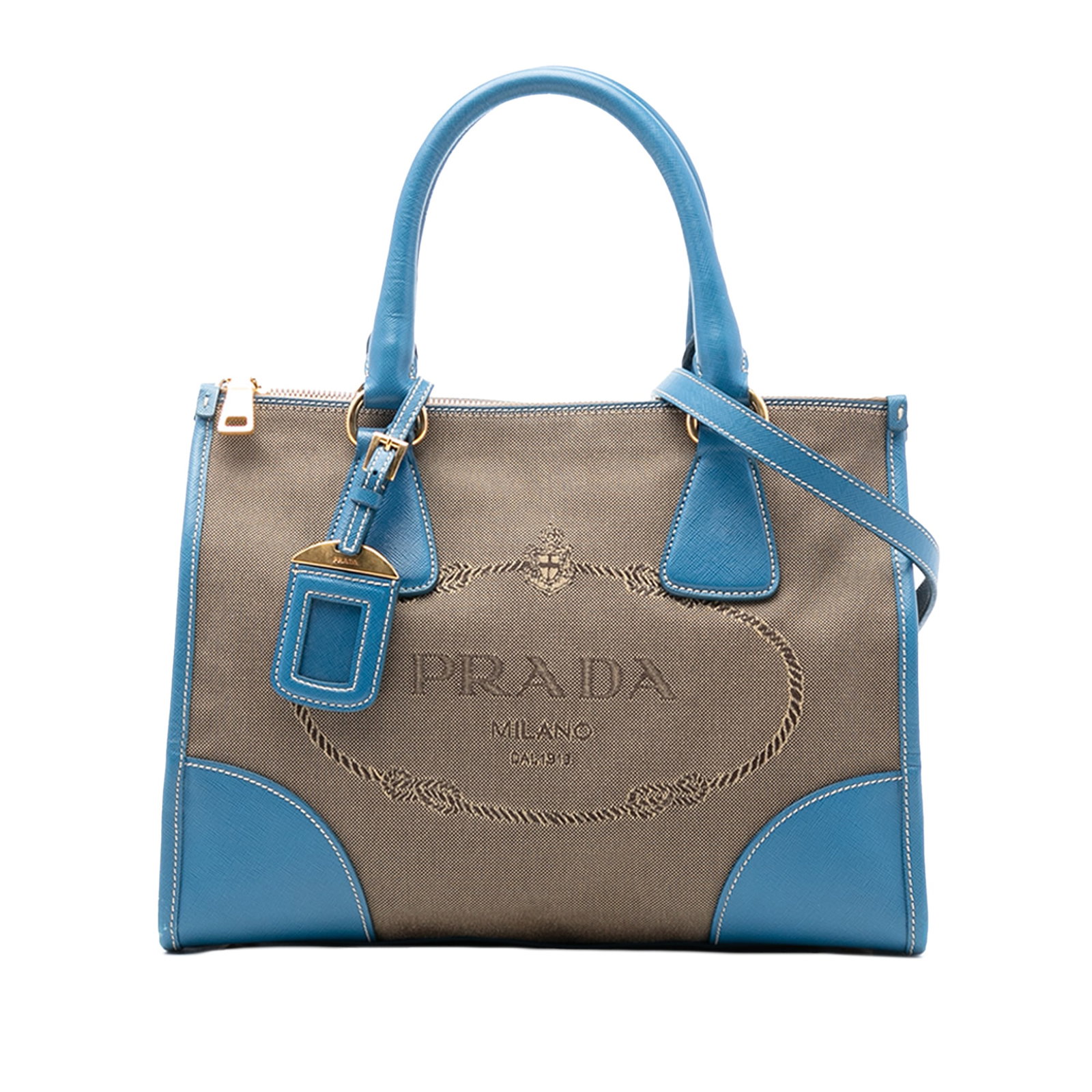 Prada Canapa Canvas Satchel with Saffiano Leather Trim and Double Zipper: Prada Canapa Canvas Satchel with Saffiano Leather Trim and Double Zipper This Prada Saffiano Trimmed Canvas Canapa Logo Double Zip Satchel features a durable canvas body with saffiano leather trim, ro