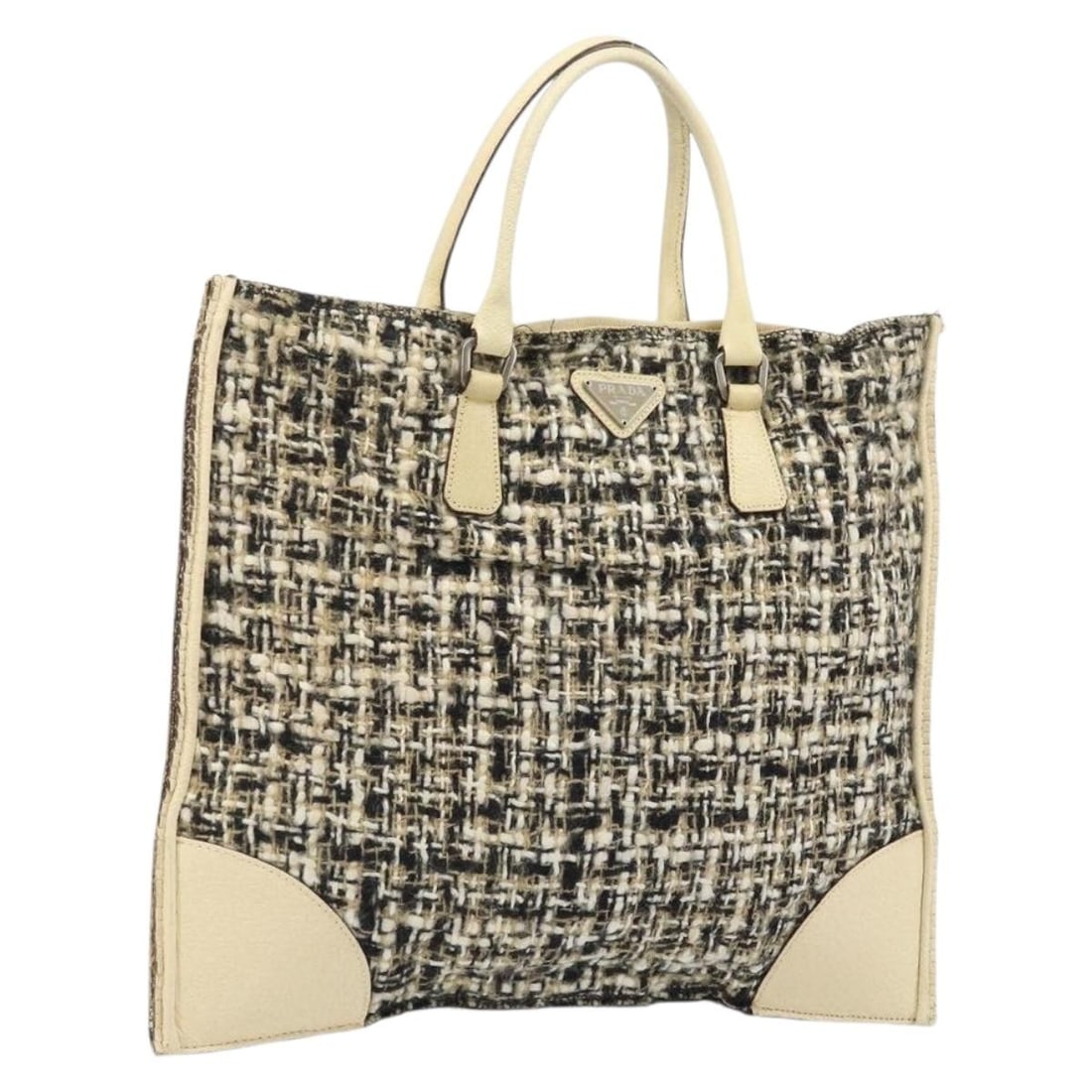 Prada Beige Silver Tweed Canvas Hand Bag Italy: Prada Beige Silver Tweed Canvas Hand Bag Italy This PRADA handbag features a beige and silver canvas exterior and is crafted in Italy. The bag shows significant signs of use, including loss of shape, 