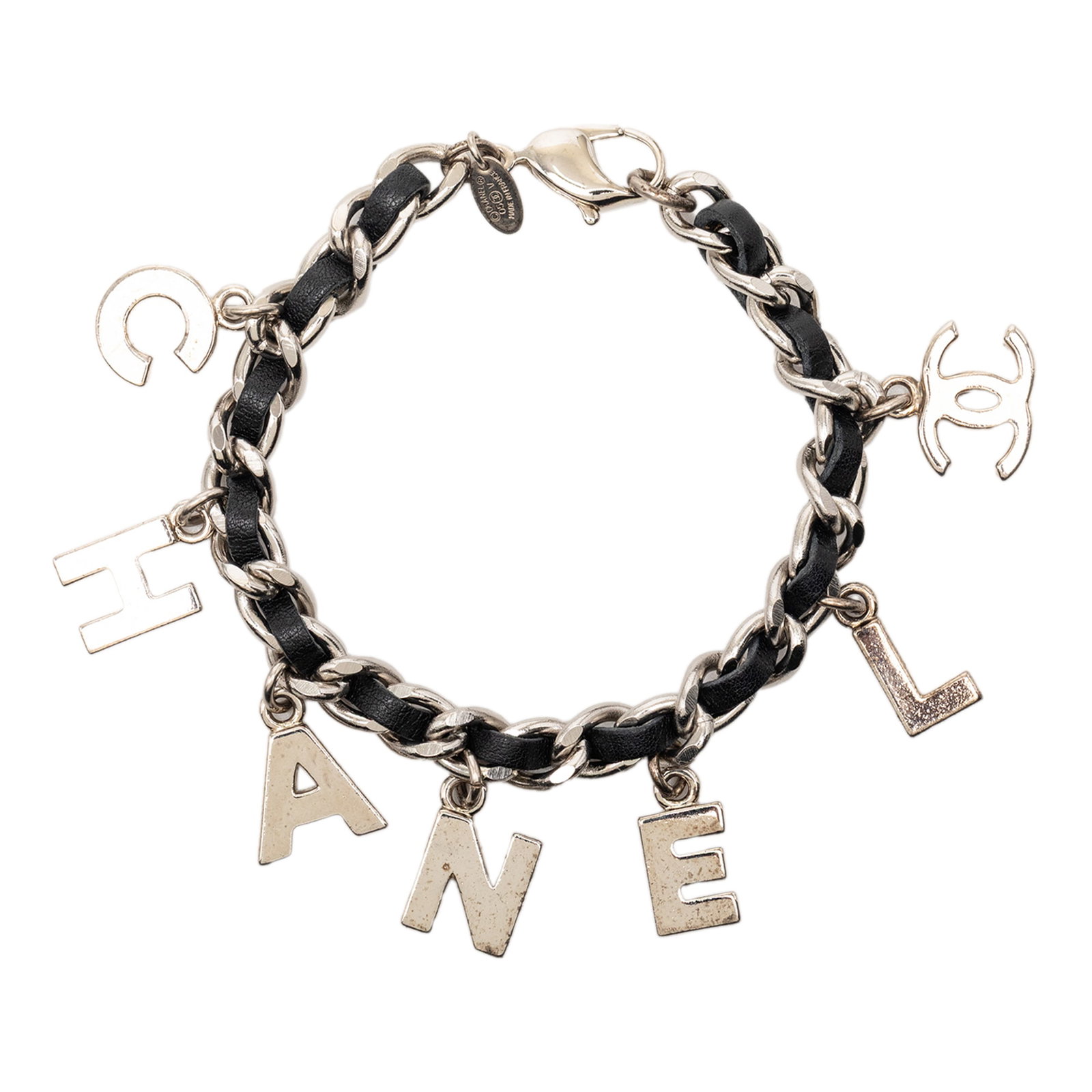 Chanel Leather Woven Charm Bracelet Silver Plated Lobster Clasp: Chanel Leather Woven Charm Bracelet Silver Plated Lobster Clasp This Chanel bracelet features a distinctive combination of silver-plated metal and woven leather, showcasing the iconic Chanel logo char
