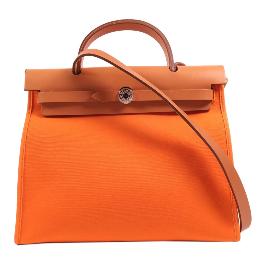Hermes Herbag PM Orange Canvas 2 Way Shoulder Bag: Hermes Herbag PM Orange Canvas 2 Way Shoulder Bag This Hermes Herbag PM is a versatile 2-way shoulder bag and handbag crafted from durable orange canvas. Designed for women, it features a practical si