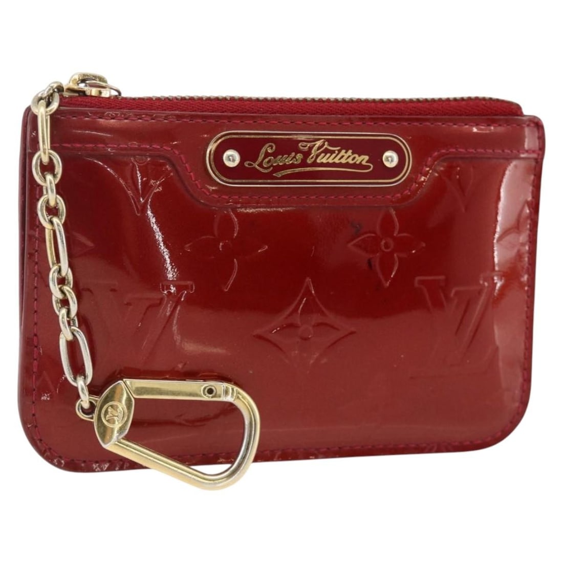 Louis Vuitton Vernis Coin Purse Rouge Grunadine M91737: Louis Vuitton Vernis Coin Purse Rouge Grunadine M91737 This Louis Vuitton Vernis Pochette Cle NM coin purse is crafted from patent leather in the Rouge Grunadine color. Designed for women, it features