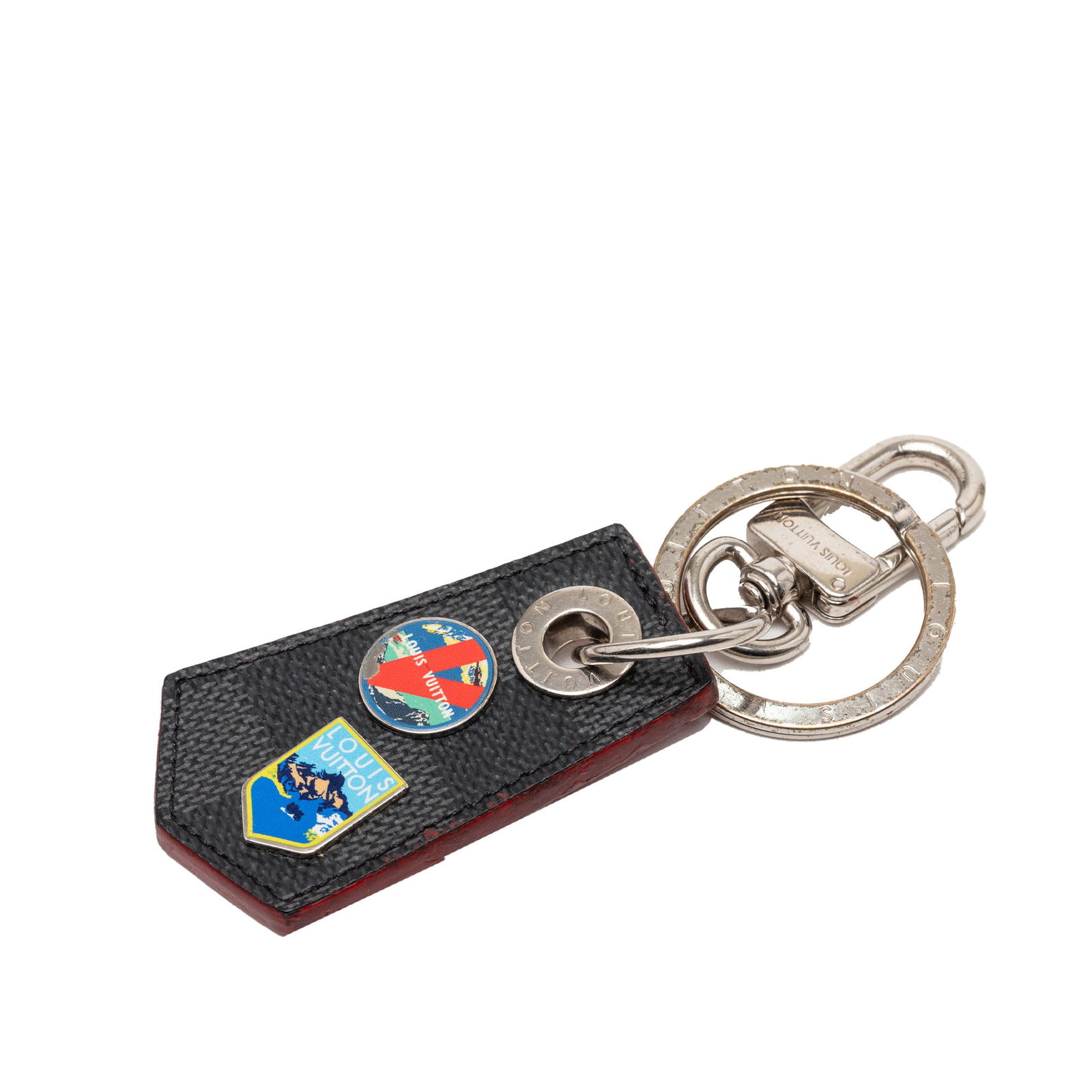 Louis Vuitton Damier Graphite Alps key holder charm: Louis Vuitton Damier Graphite Alps key holder charm This Louis Vuitton Damier Graphite Alps Enchappe bag charm and key holder features a Damier canvas body with a metal key ring and hook attachment. T