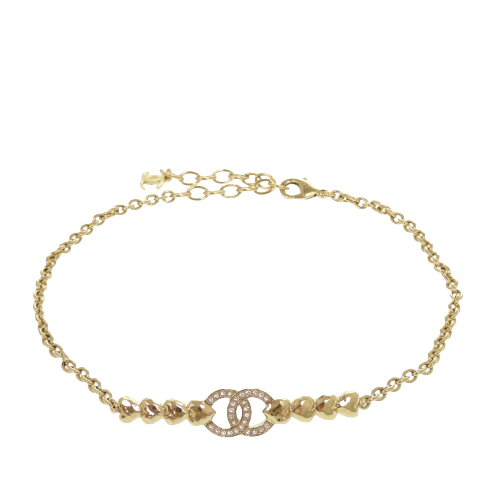 Chanel CC Crystal Embellished Gold Tone Choker Necklace: Chanel CC Crystal Embellished Gold Tone Choker Necklace This Chanel choker necklace features a gold-tone metal chain adorned with crystal embellishments and a signature CC charm. It is secured with a 
