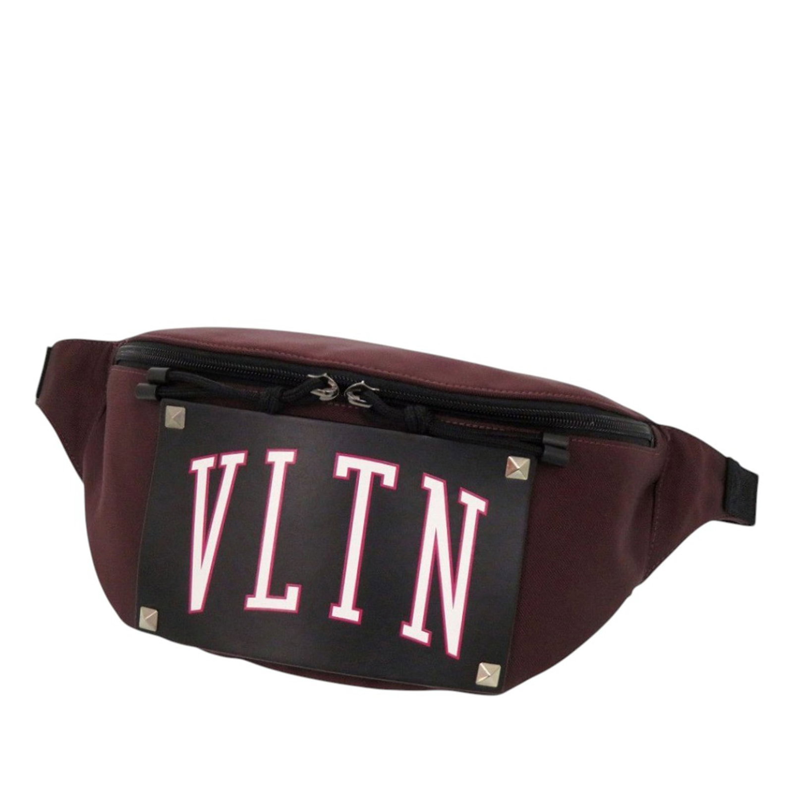 Valentino Rockstud VLTN nylon leather belt bag: Valentino Rockstud VLTN nylon leather belt bag This Valentino VLTN Rockstud belt bag combines a durable nylon body with a leather patch featuring signature rockstud detailing. It is equipped with an a